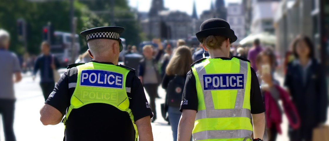 Police walking through a city centre