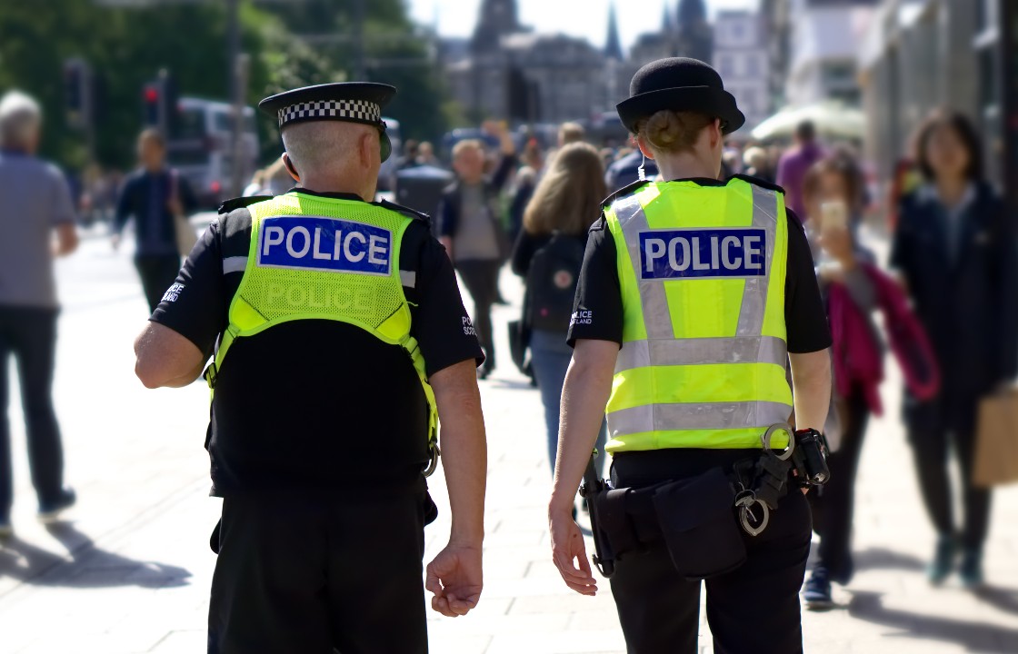 Police walking through a city centre